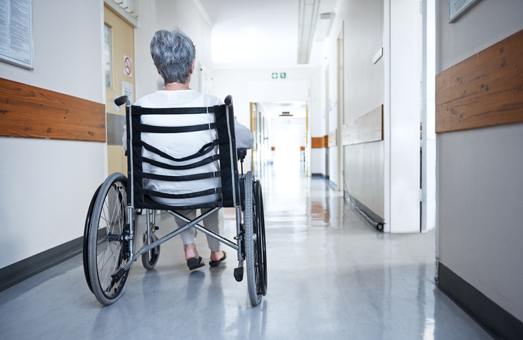 Rearview shot of a senior woman sitting in a wheelchair